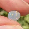 Semi-black solid opal 0.6 ct from Lightening Ridge.