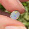 Semi-black solid opal 0.6 ct from Lightening Ridge.